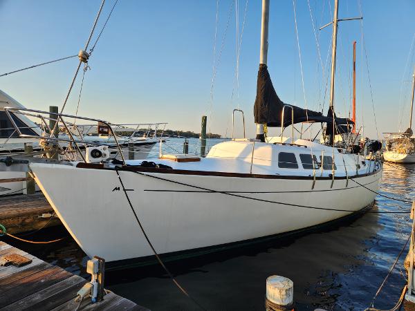 Morgan 45 Ketch 1979 Morgan 45 Ketch sailboat docked at marina, side view.