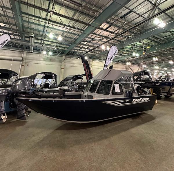 KingFisher 1825 Warrior Sport 2024 KingFisher 1825 Warrior Sport boat displayed at an indoor boat show.