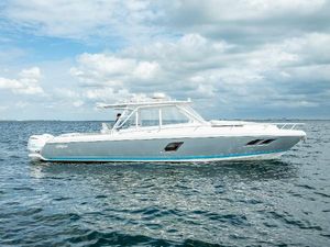 Intrepid 400 Cuddy 2015 Intrepid 400 Cuddy boat on open water under cloudy sky.