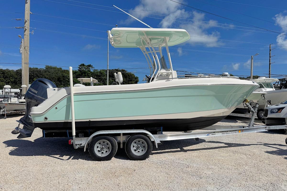 Robalo R222 Center Console 2016 Robalo R222 Center Console boat on trailer under clear blue sky.