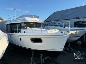 Beneteau Swift Trawler 30 2017 Beneteau Swift Trawler 30 in storage, white exterior, docked at a marina.