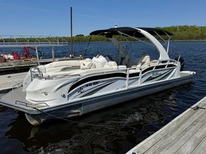 JC 26 SportToon TT RFL 2019 JC 26 SportToon TT RFL pontoon boat docked on a sunny day.