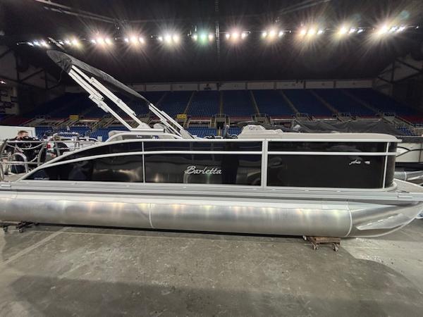 Barletta ARIA 22UC 2025 Barletta ARIA 22UC pontoon boat displayed indoors under bright lights.