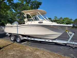 Grady-White Adventure 218 2025 Grady-White Adventure 218 boat on trailer, parked outdoors.