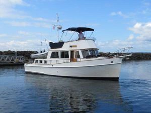 Grand Banks 42 Classic 1985 Grand Banks 42 Classic yacht cruising on calm waters under a clear blue sky.
