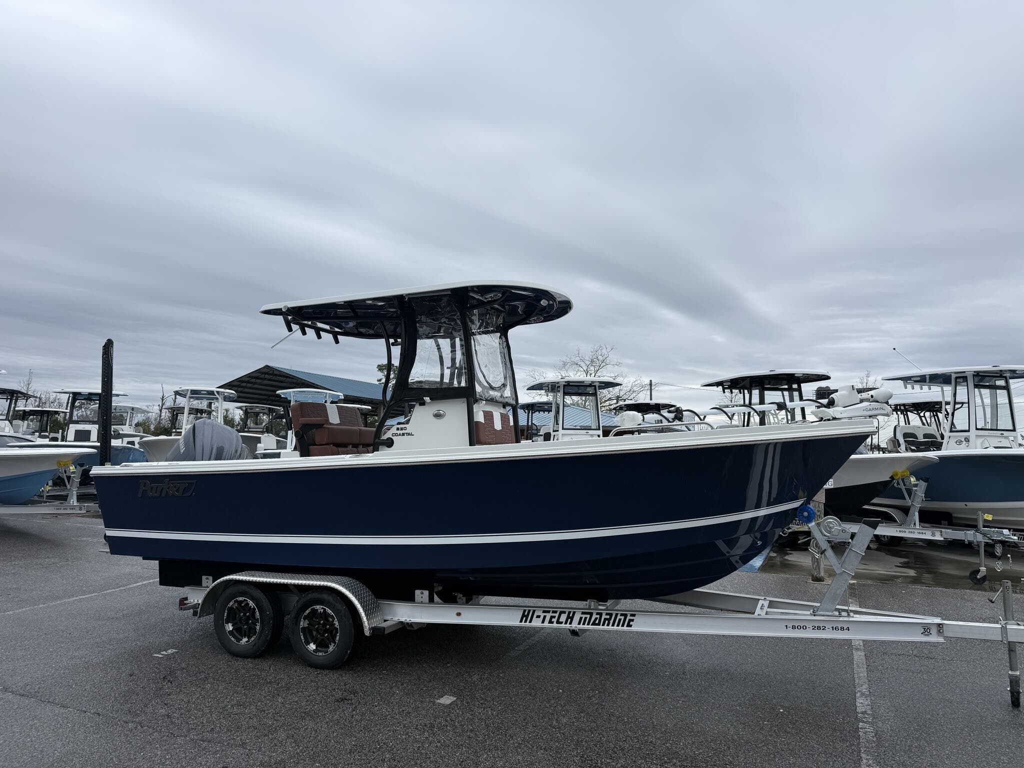 Parker 230 Coastal Elite Parker 230 Coastal Elite 2026 parked on trailer outdoors.