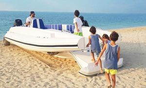 Ocean Craft Marine 9.5 M Beachlander Family enjoying Ocean Craft Marine 9.5 M Beachlander boat on sandy beach, 2022 model.