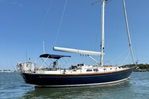 Hinckley Sou'wester 42 Sloop 1994 Hinckley Sou'wester 42 Sloop sailing yacht on calm water under clear blue sky.