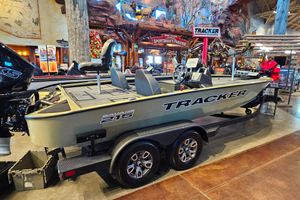 Tracker Savage 215 2026 Tracker Savage 215 boat displayed indoors with festive decorations.