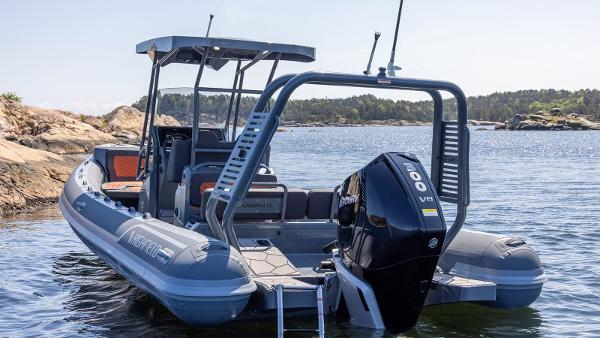 Highfield Sport 760 2025 Highfield Sport 760 boat with powerful outboard motor on scenic water.