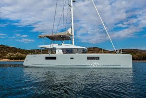 Lagoon 52 F 2021 Lagoon 52 F catamaran sailing on calm waters under a partly cloudy sky.