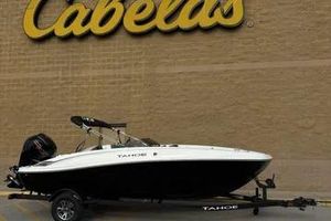 Tahoe T18 2026 Tahoe T18 boat on trailer outside Cabela's store.