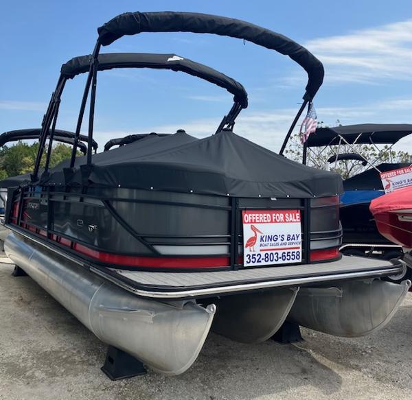Starcraft SLS 3 Q 2024 Starcraft SLS 3 Q pontoon boat for sale, black cover, dealership sign.