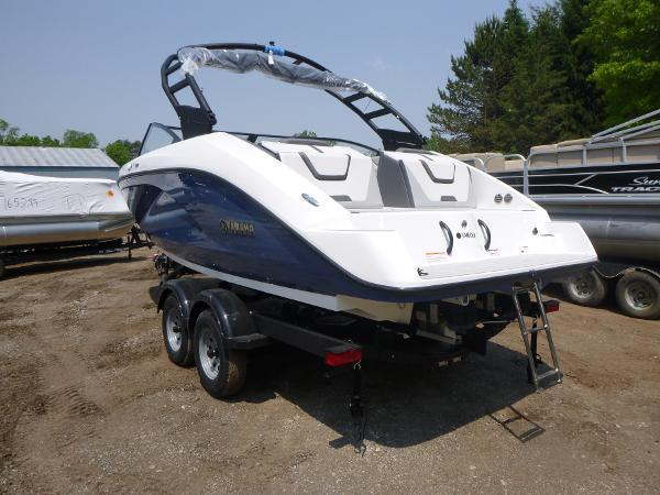 Yamaha Boats AR220 2025 Yamaha Boats AR220 on trailer, sleek design, parked outdoors.