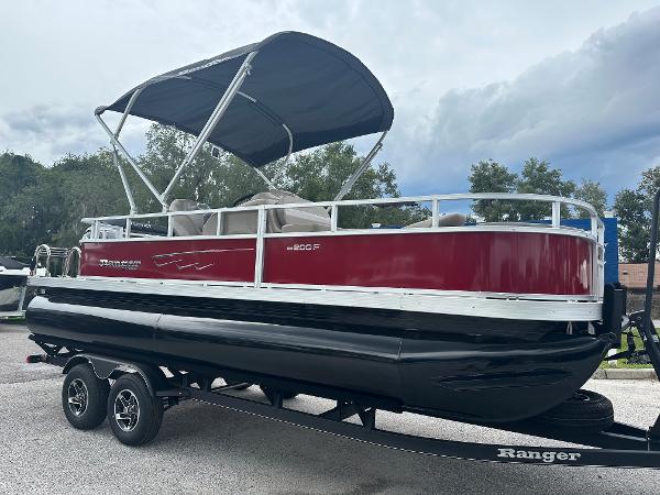Ranger Reata 200F 2024 Ranger Reata 200F pontoon boat with canopy on trailer.