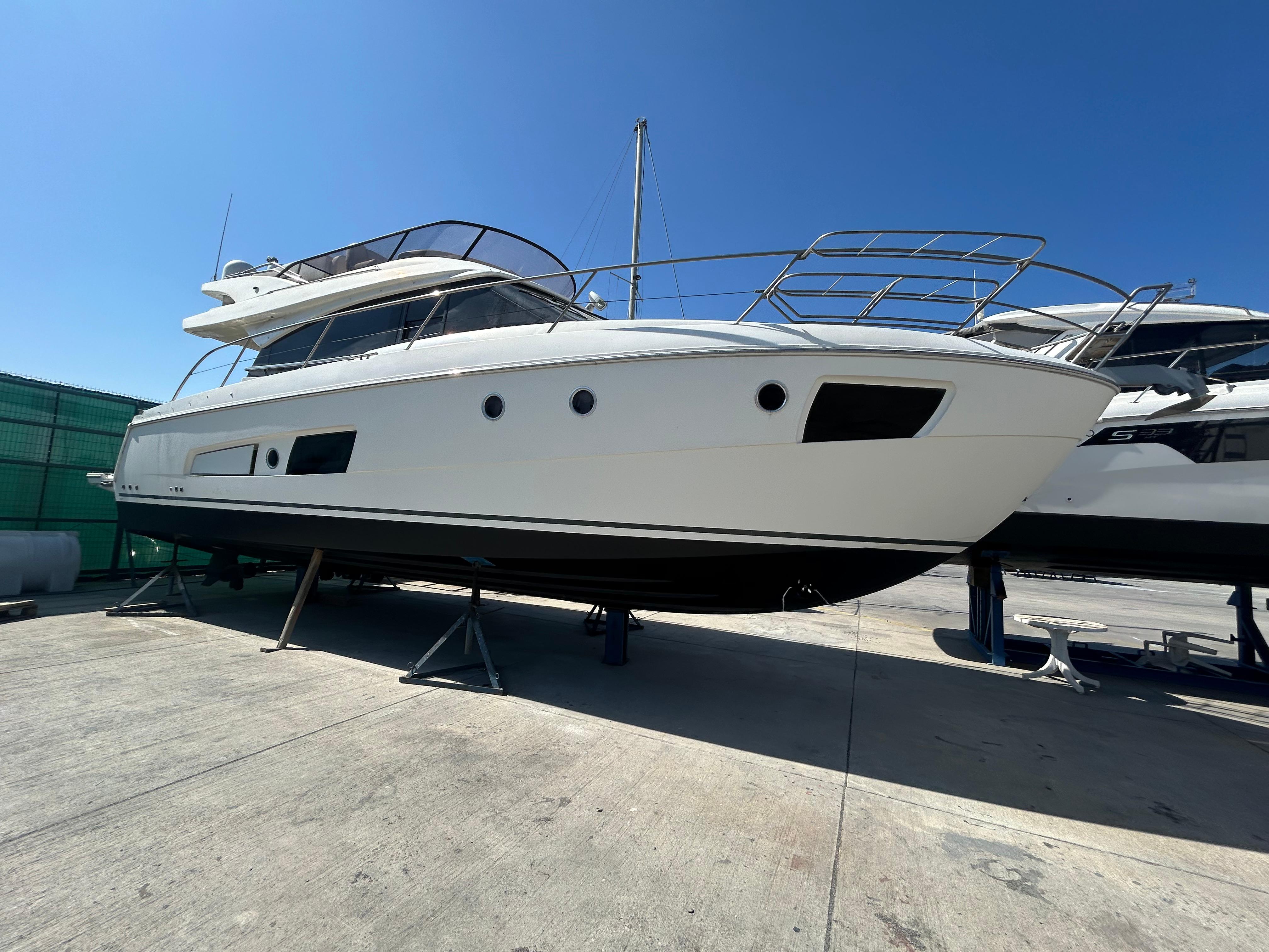 Bavaria Virtess 420 Fly 2015 Bavaria Virtess 420 Fly yacht on dry dock under clear blue sky.