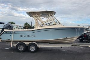 Grady-White Freedom 235 2023 Grady-White Freedom 235 boat named "Blue Heron" on trailer, side view.