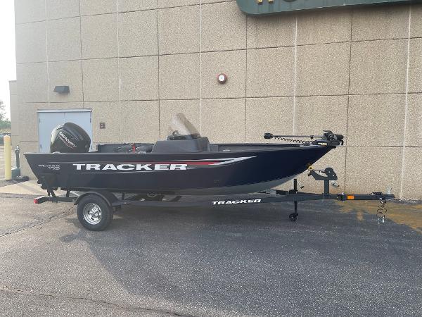 Tracker Pro Guide V-16 SC 2025 Tracker Pro Guide V-16 SC boat on trailer, parked outdoors.