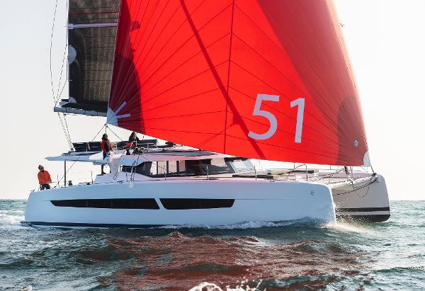 Fountaine Pajot Aura 51 2025 Fountaine Pajot Aura 51 catamaran sailing with red sails.