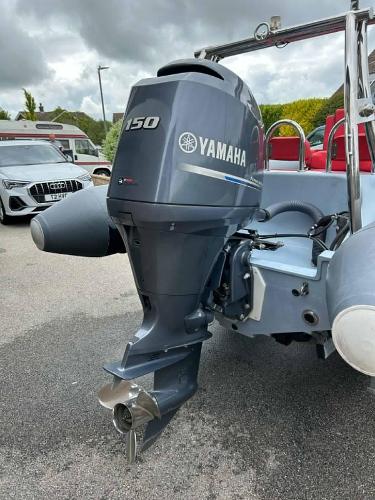 Ribeye A600 Ribeye A600 boat with Yamaha 150 outboard motor, 2014 model, parked outdoors.