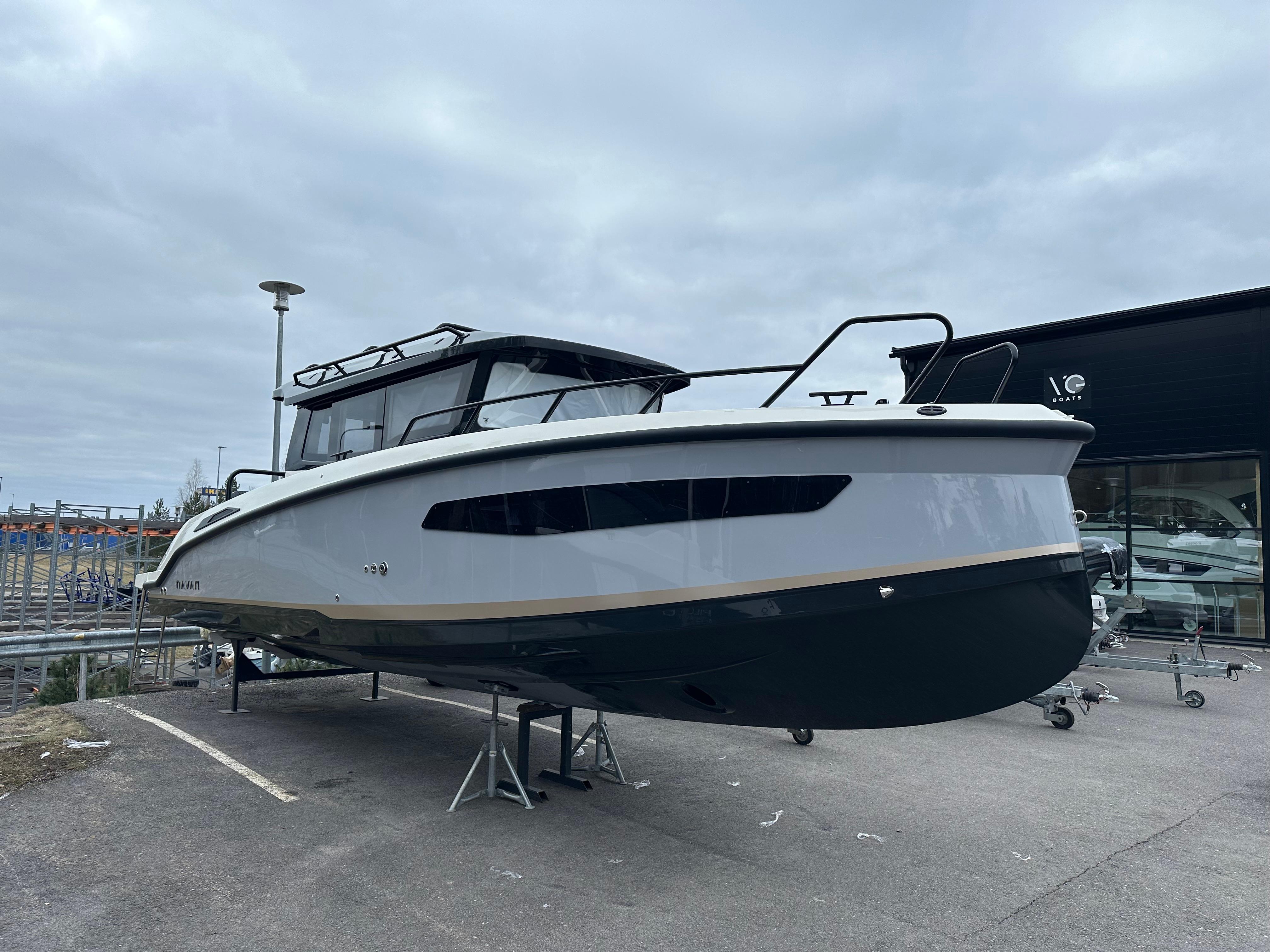 Navan C30 2024 Navan C30 boat displayed outdoors on a stand under cloudy skies.