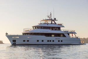 Gulf Craft nomad 101 2023 Gulf Craft Nomad 101 yacht on calm water at sunset.