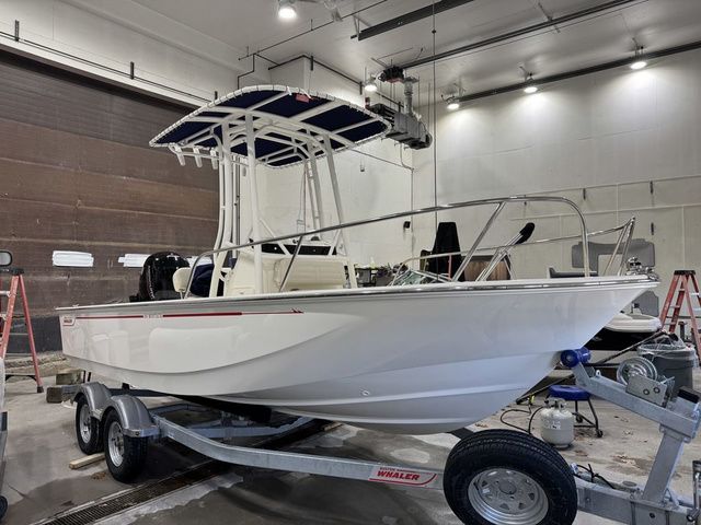 Boston Whaler 190 Montauk 2025 Boston Whaler 190 Montauk boat on trailer in a well-lit garage.