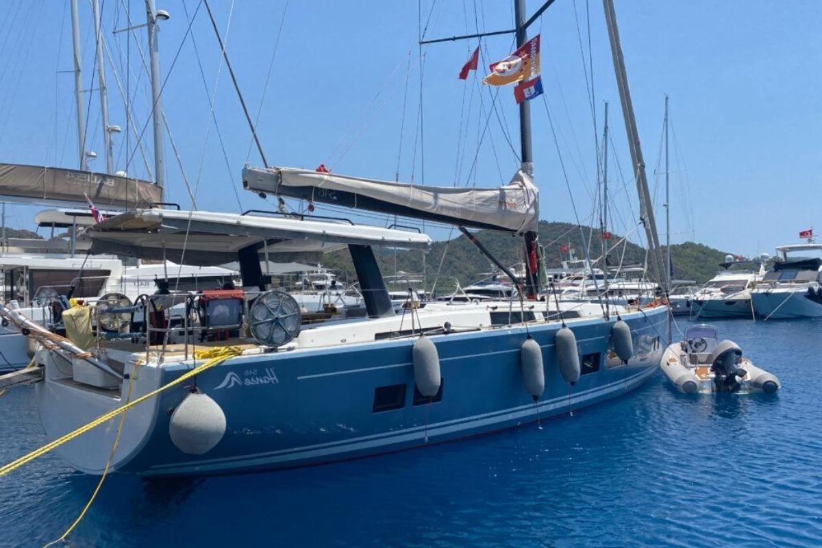 Hanse 548 2018 Hanse 548 yacht docked in a marina, surrounded by other boats.