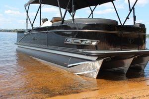 Tahoe Pontoon Cascade Platinum Versatile Rear Bench 23' 2023 Tahoe Pontoon Cascade Platinum Versatile Rear Bench 23' on a sandy shore.