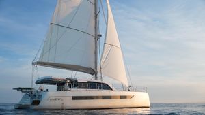 Custom Explocat 52 Sailing catamaran Explocat 52, 2025 model, cruising on calm ocean waters at sunset.
