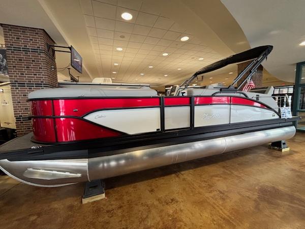 Barletta Cabrio 22M 2025 Barletta Cabrio 22M pontoon boat displayed indoors, featuring a sleek red and silver design.