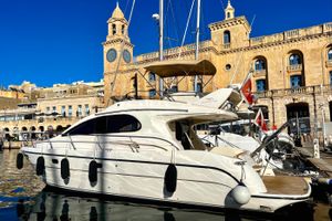 Intermare 37 Fly Luxury 2005 Intermare 37 FLY CRUISER yacht docked in scenic marina.