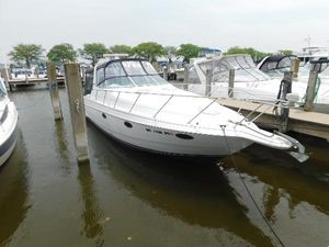 Chris-Craft 302 Crowne 1991 Chris-Craft 302 Crowne boat docked at marina, white exterior, calm water.