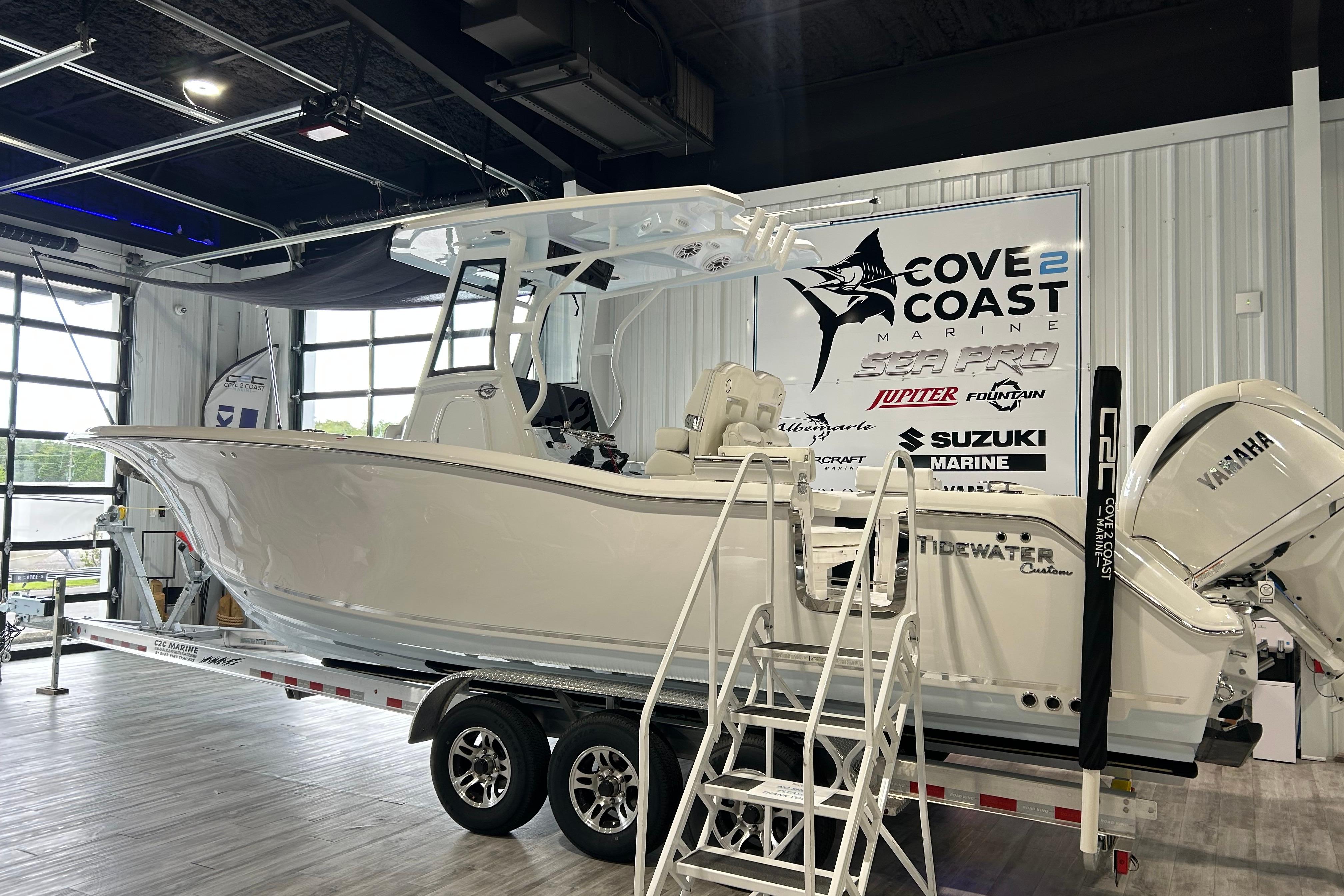 Tidewater 282 CC Adventure 2026 Tidewater 282 CC Adventure boat displayed indoors on a trailer at Cove 2 Coast Marine.
