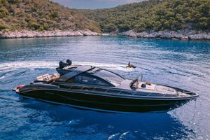 Riva 68 Ego Luxury 2006 Riva 68 Ego yacht cruising in scenic blue waters.