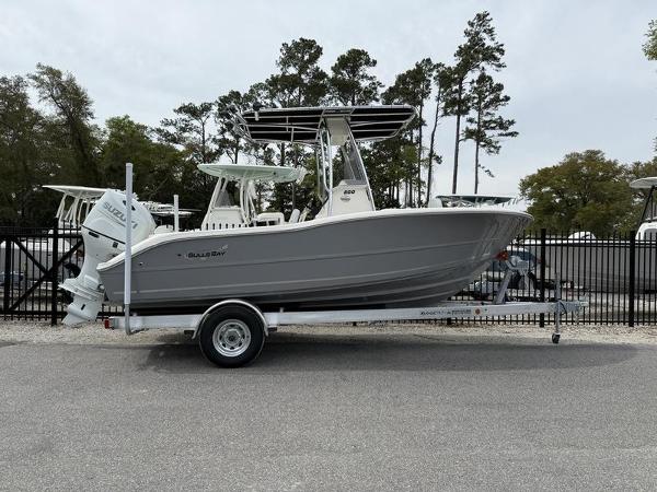 Bulls Bay 200 CC 2025 Bulls Bay 200 CC boat on trailer, parked outdoors near trees and fencing.