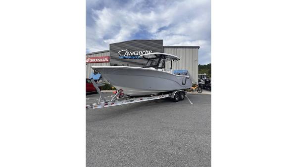 Sea Fox 288 Commander 2025 Sea Fox 288 Commander boat on trailer outside dealership.