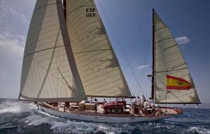 Classic Yacht -Yawl-Analia 75 / 23m Classic 1925 Yacht Yawl-Analia 75 sailing with Spanish flag, crew onboard, under clear skies.