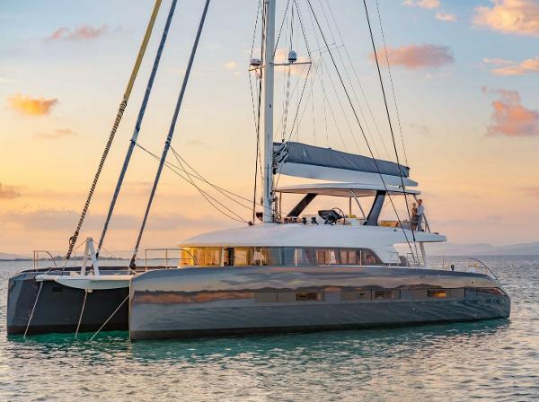Lagoon Seventy 7 2021 Lagoon Seventy 7 yacht sailing at sunset on calm waters.