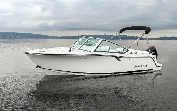 Blackfin 232DC - Dual Console 2024 Blackfin 232DC Dual Console boat on calm water under cloudy skies.