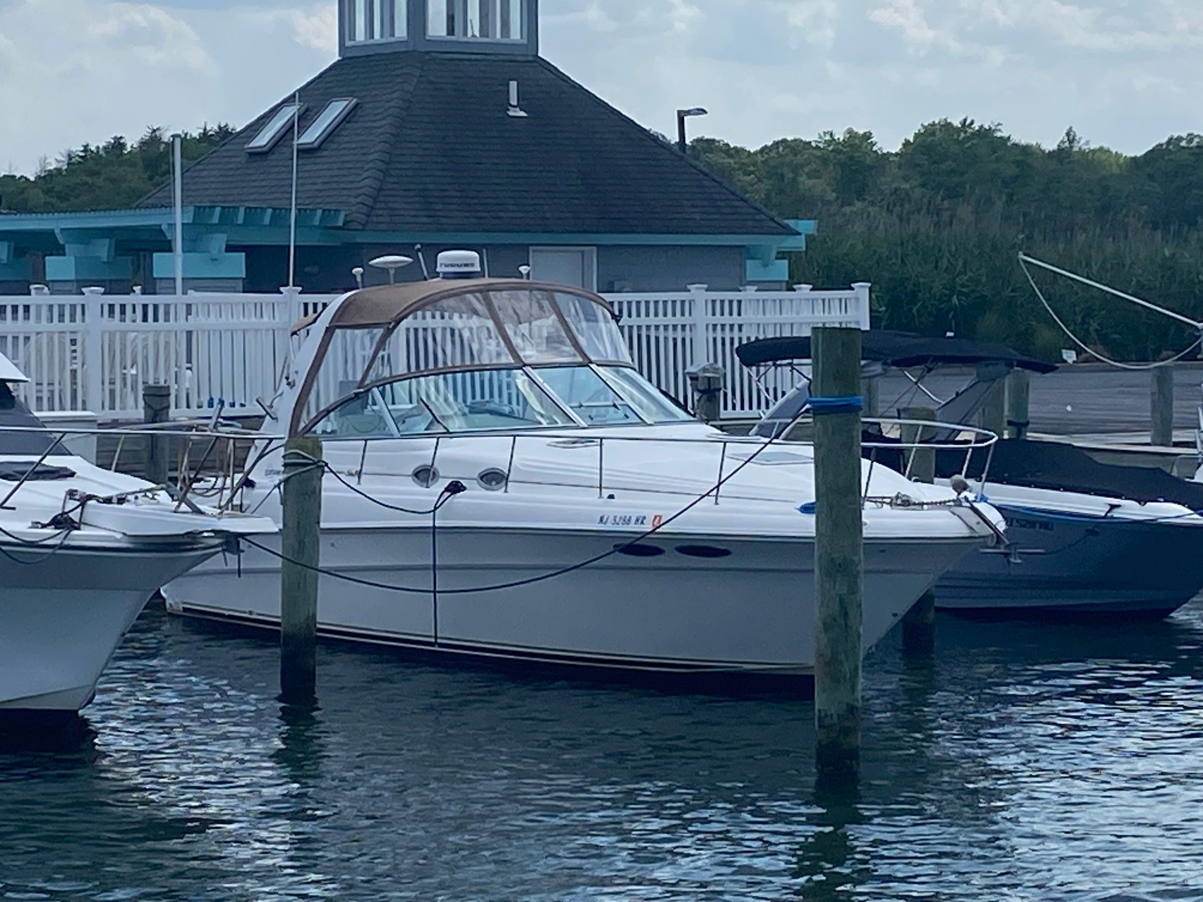 Sea Ray 340 Sundancer 1999 Sea Ray 340 Sundancer docked at marina, surrounded by other boats.