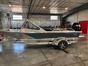 Wooldridge 18 Alaskan 2025 Wooldridge 18 Alaskan boat on trailer in a warehouse setting.