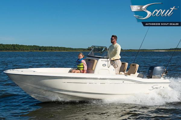 Scout 175 Sportfish 2024 Scout 175 Sportfish boat cruising on a lake with two passengers.