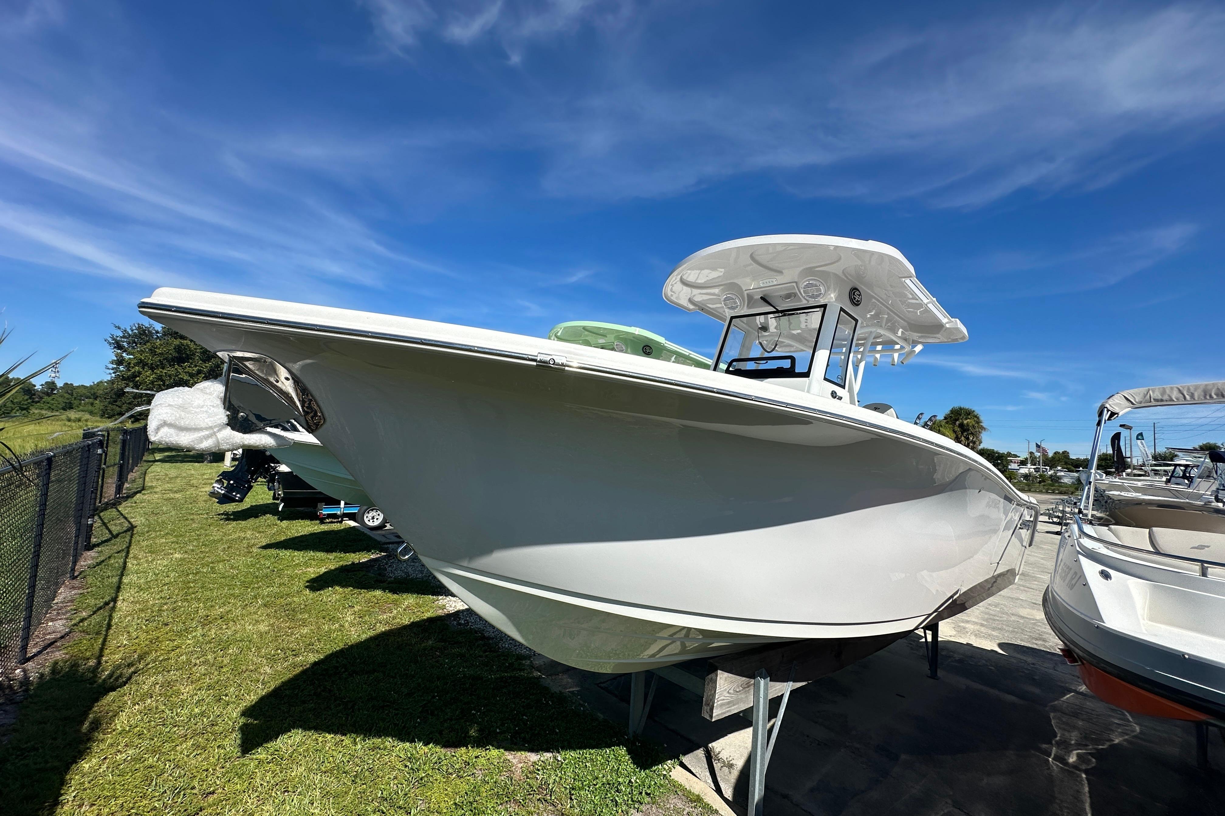 Sea Pro 262 Center Console 2026 Sea Pro 262 Center Console boat displayed outdoors under a clear blue sky.