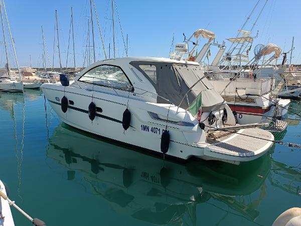 Bavaria 38 HT Sport 2011 Bavaria 38 HT Sport yacht docked in a marina, surrounded by other boats.