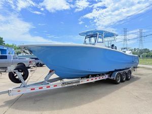 Tidewater 302 CC Adventure 2026 Tidewater 302 CC Adventure boat on trailer, blue hull, parked outdoors.