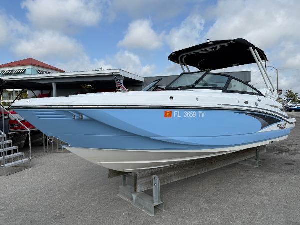 Monterey M-45 2024 Monterey M-45 boat in light blue, displayed outdoors on a stand.