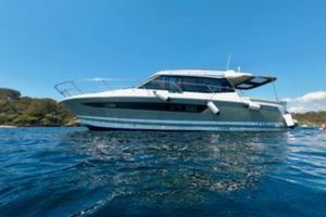 Jeanneau NC 11 2012 Jeanneau NC11 yacht on calm blue water under clear sky.