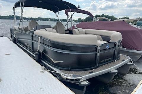 Premier 230 SunSation RF 2020 Premier 230 SunSation RF pontoon boat docked on a sunny day.