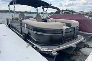Premier 230 SunSation RF 2020 Premier 230 SunSation RF pontoon boat docked on a lake.